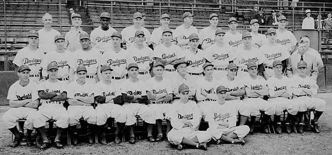 Norman Berman had a front-row seat in the team photo (legs crossed on right) and as a witness to history with the Jackie Robinson-led Dodgers.